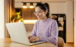 A test-taker completing an online exam on a laptop in a comfortable, distraction-free environment